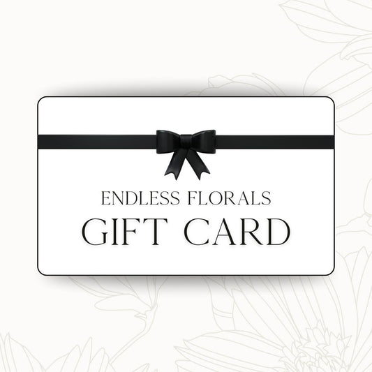 Gift card with a black bow and 'Endless Florals' text on a white background